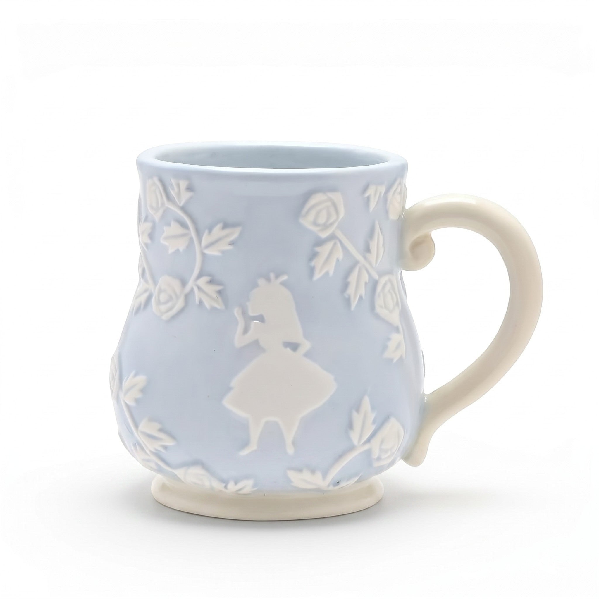 Mug Le Studio Fantastique Alice au Pays des Merveilles en céramique bleue avec motifs en relief blancs